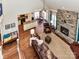 An open-concept view of the living room with a stone fireplace, and view to the kitchen at 816 Springs Rd, Dallas, NC 28034