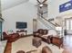 Spacious living area with vaulted ceilings, fireplace, hardwood floors, and staircase at 816 Springs Rd, Dallas, NC 28034