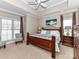 Comfortable bedroom featuring a ceiling fan, carpet and hardwood furniture at 816 Springs Rd, Dallas, NC 28034
