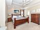 Spacious bedroom featuring a tray ceiling, hardwood furniture and ensuite bathroom at 816 Springs Rd, Dallas, NC 28034