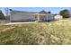 Home's backyard, including a covered patio area, offering space for relaxation at 867 Meadow Hill Ct, Lincolnton, NC 28092