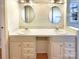 Well-lit bathroom featuring double sinks and vanities, offering ample space and convenience for daily routines at 867 Meadow Hill Ct, Lincolnton, NC 28092