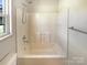 Bright bathroom with a white shower-tub combination at 867 Meadow Hill Ct, Lincolnton, NC 28092