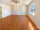 Spacious bedroom featuring hardwood floors, a ceiling fan, and natural light from a window at 867 Meadow Hill Ct, Lincolnton, NC 28092