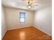 Comfortable bedroom featuring hardwood floors, a ceiling fan, and a window at 867 Meadow Hill Ct, Lincolnton, NC 28092
