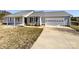 Inviting home featuring a well-kept lawn, a covered entryway, and an attached garage, combining charm and functionality at 867 Meadow Hill Ct, Lincolnton, NC 28092