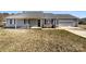 Charming home featuring a well-manicured lawn, covered porch, and attached garage, offering both curb appeal and practicality at 867 Meadow Hill Ct, Lincolnton, NC 28092
