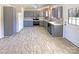 Modern kitchen with grey cabinets, stainless steel appliances, and tiled backsplash, perfect for cooking and entertaining guests at 867 Meadow Hill Ct, Lincolnton, NC 28092