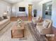 Bright living room with hardwood floors, neutral decor, and open access to a modern kitchen, perfect for entertaining at 867 Meadow Hill Ct, Lincolnton, NC 28092