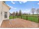 Expansive deck overlooks lush backyard with trees and field views under a bright sky at 8806 Cool Meadow Dr, Huntersville, NC 28078