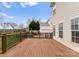 A beautiful deck overlooks a backyard with a wooden fence at 8806 Cool Meadow Dr, Huntersville, NC 28078