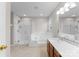 Bright bathroom featuring a glass shower, tub, and double vanity sink at 8806 Cool Meadow Dr, Huntersville, NC 28078
