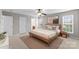 Neutral bedroom with ceiling fan, natural light and ensuite bathroom at 8806 Cool Meadow Dr, Huntersville, NC 28078