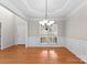 Formal dining area with hardwood floors, neutral walls, and large windows for ample natural light at 8806 Cool Meadow Dr, Huntersville, NC 28078