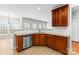 Well-lit kitchen features stainless steel appliances, granite countertops, and tile flooring at 8806 Cool Meadow Dr, Huntersville, NC 28078