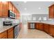 Spacious kitchen featuring stainless steel appliances, granite countertops, and ample cabinet space at 8806 Cool Meadow Dr, Huntersville, NC 28078