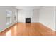 Inviting living room featuring a fireplace and hardwood floors at 8806 Cool Meadow Dr, Huntersville, NC 28078