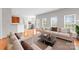 Bright living room with hardwood floors, neutral decor, and lots of natural light at 8806 Cool Meadow Dr, Huntersville, NC 28078