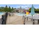 Community pool featuring a splash zone and playground next to a covered clubhouse with seating at 8806 Cool Meadow Dr, Huntersville, NC 28078