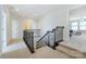 Upstairs hallway with access to bedrooms and stairs at 900 Crooked River Dr, Waxhaw, NC 28173