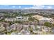 Aerial view of neighborhood featuring mature trees and commercial area at 9239 Silver Pine Dr, Charlotte, NC 28277