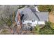 Aerial view of house featuring a deck, patio and neutral-colored roofing at 9239 Silver Pine Dr, Charlotte, NC 28277