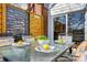 Cozy back deck with outdoor dining area and view of greenery at 9239 Silver Pine Dr, Charlotte, NC 28277