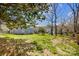 Expansive backyard featuring a well-maintained lawn and mature trees at 9239 Silver Pine Dr, Charlotte, NC 28277