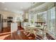 Bright dining area features a round table set for dinner, with backyard views at 9239 Silver Pine Dr, Charlotte, NC 28277