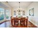 Dining area with bay window, and a pendant light fixture, perfect for Gathering gatherings at 9239 Silver Pine Dr, Charlotte, NC 28277