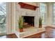 Elegant stone fireplace with decorative plants in a cozy living space at 9239 Silver Pine Dr, Charlotte, NC 28277