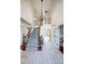Grand foyer with high ceilings, staircase, and tiled floors leading to other rooms at 9239 Silver Pine Dr, Charlotte, NC 28277