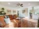 Comfortable living room with hardwood floors, recessed lighting, and decorative paintings at 9239 Silver Pine Dr, Charlotte, NC 28277