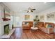 Spacious living room with stone fireplace, ceiling fan, and stylish furnishings at 9239 Silver Pine Dr, Charlotte, NC 28277