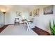 Cozy office space with hardwood floors, three paintings and natural light at 9239 Silver Pine Dr, Charlotte, NC 28277