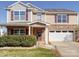 Attractive two-story home with stone accents, a covered front porch, and a spacious two-car garage at 1000 Sweetgum St, Gastonia, NC 28054