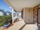 Inviting covered front porch featuring stone accents and providing an attractive entryway to the home at 1000 Sweetgum St, Gastonia, NC 28054