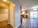 Open-concept living area with wood floors, and modern finishes, seamlessly connecting the kitchen and bathroom spaces at 1000 Sweetgum St, Gastonia, NC 28054