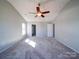 Inviting main bedroom featuring a ceiling fan and an en-suite bathroom at 1000 Sweetgum St, Gastonia, NC 28054