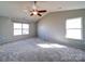 Spacious main bedroom with vaulted ceiling, a ceiling fan, and bright windows at 1000 Sweetgum St, Gastonia, NC 28054