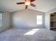 Large main bedroom with a ceiling fan, bright windows, and a walk-in closet at 1000 Sweetgum St, Gastonia, NC 28054