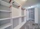Spacious walk-in closet providing ample storage with built-in shelving and racks at 1000 Sweetgum St, Gastonia, NC 28054