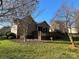 Scenic backyard with a spacious wooden deck, perfect for outdoor gatherings and relaxation at 104 Johnsbury Dr, Stanley, NC 28164