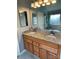 Bright bathroom featuring a double sink vanity with granite counters and a glass-enclosed shower at 104 Johnsbury Dr, Stanley, NC 28164