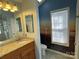 Bathroom vanity featuring granite countertops and soft, natural lighting at 104 Johnsbury Dr, Stanley, NC 28164