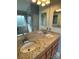 Bathroom showcasing a double sink vanity, granite countertops, and a modern, glass-enclosed shower at 104 Johnsbury Dr, Stanley, NC 28164