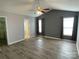Spacious bedroom featuring modern gray walls, ample natural light, and wood-look floors at 104 Johnsbury Dr, Stanley, NC 28164