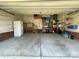 Spacious garage featuring ample storage shelves and a workbench area for hobbies or projects at 104 Johnsbury Dr, Stanley, NC 28164