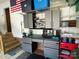 Close-up of the garage showcasing storage solutions and a workbench area for DIY enthusiasts at 104 Johnsbury Dr, Stanley, NC 28164