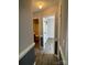 Hallway leading to a bathroom and bedroom with modern finishes and neutral colors at 104 Johnsbury Dr, Stanley, NC 28164